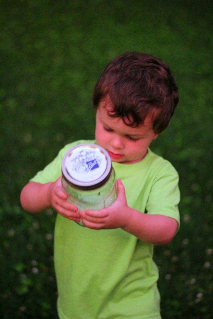 catching fireflies at summer kickoff party