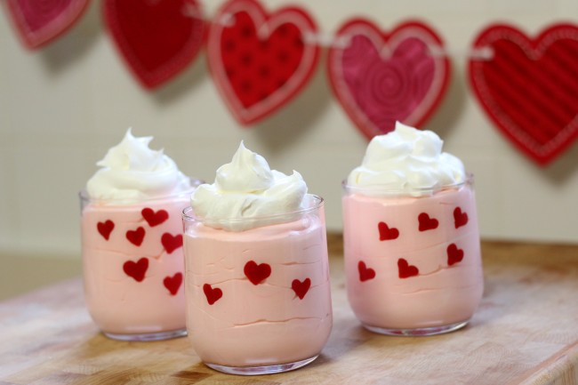 Valentine's Day Easy Heart Dessert Cups made with pudding, whipped topping, and candy melts