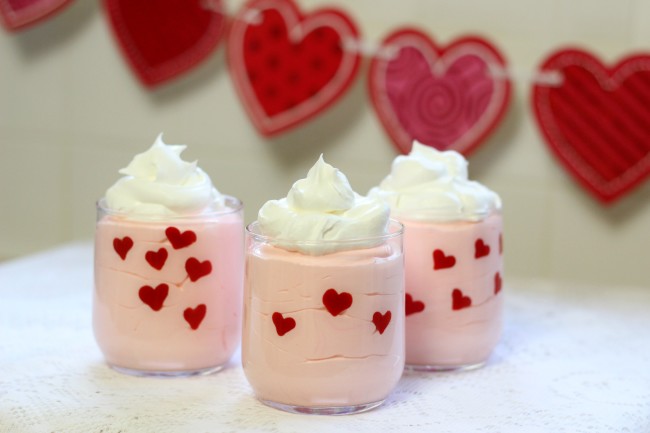 Valentine's Day Easy Heart Dessert Cups made with pudding, whipped topping, and candy melts