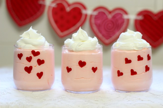 Valentine's Day Easy Heart Dessert Cups made with pudding, whipped topping, and candy melts